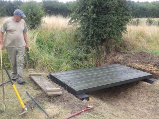 Ben inspects the decking for alignment before it is secured to the bearers