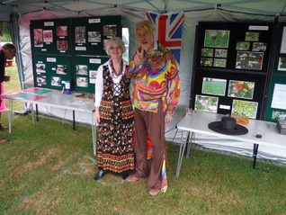 Peter and Maureen in the Hollingbourne Meadows Trusts marquee appropriately dressed in the fetes sixties theme 