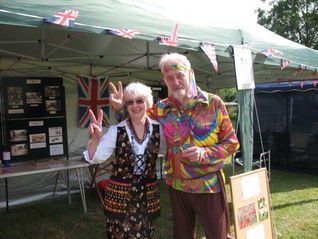 Peter and Maureen outside the Hollingbourne Meadows Trusts marquee appropriately dressed in the fetes Swinging Sixties theme 