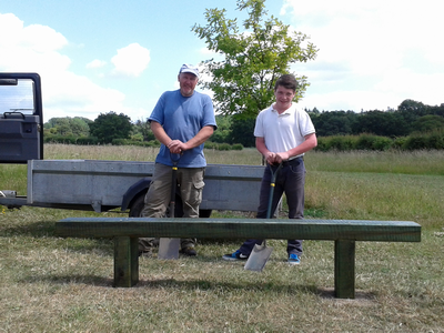 Ben and Shaun standing behind the newly installed bench