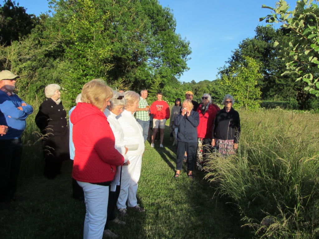 Gathering around the W.I. Tree to sing Jerusalem